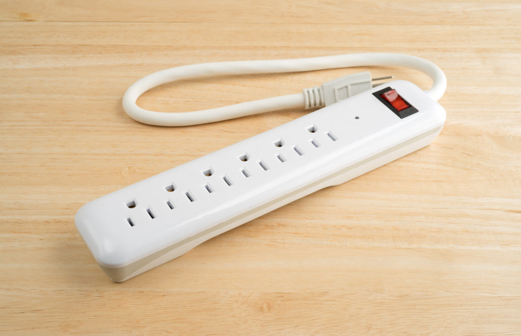Surge Protector sitting on a wooden table.