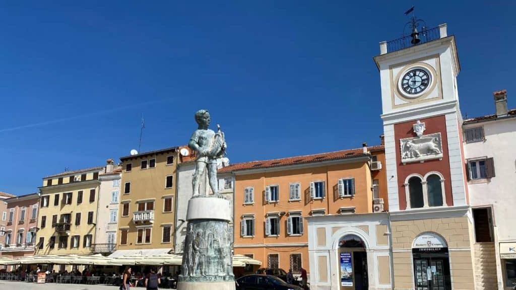 Statue of a boy and a fish in Old Town Rovinj. 15 Things to do in Rovinj, Croatia.