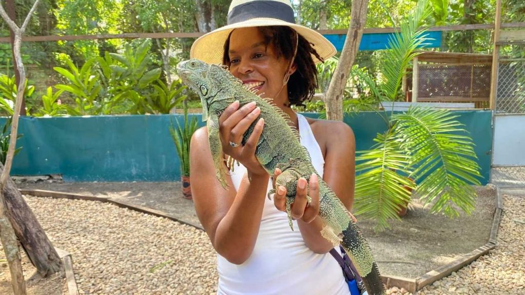 Kendra holding a Green Iguana