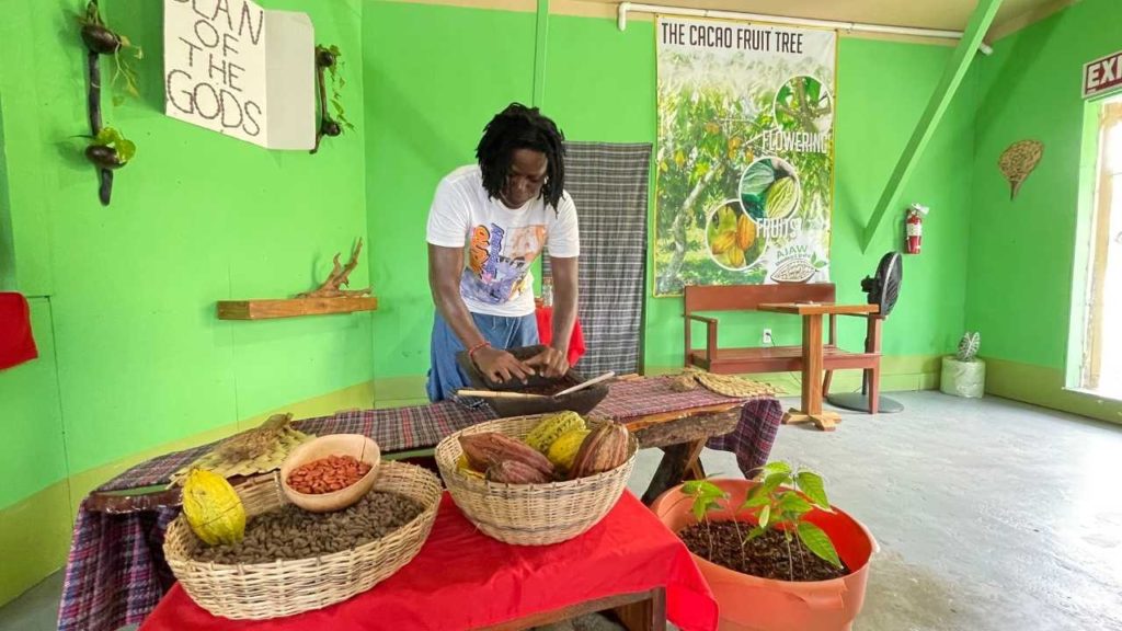 David grinding cacao at Ajaw Chocolate