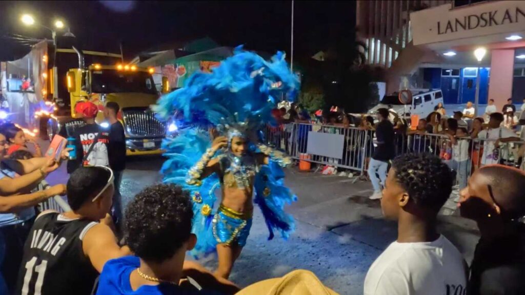 Man wearing a blue feather costume in the carnival a fun thing to do in Willemstad Curacao