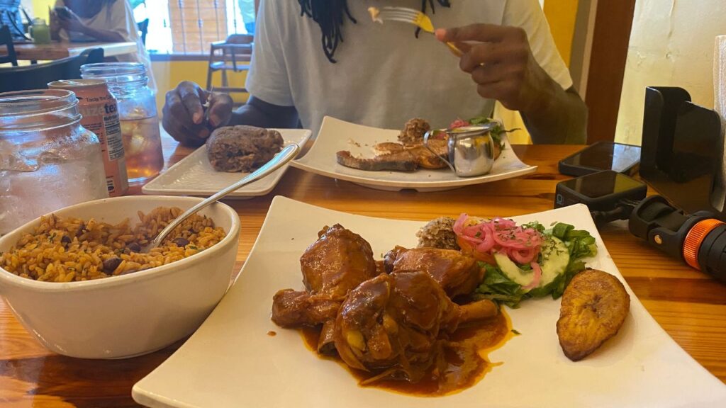 Stewed chicken and fish at Komedor Krioyo