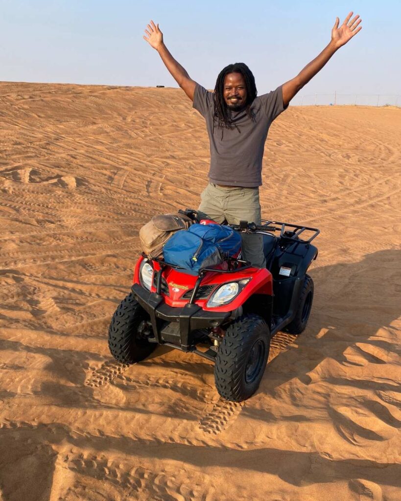 David on a 4-wheeler in the sand